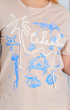 Blusa beige con estampado y detalle 3D