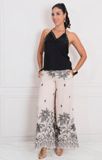 Blusa negra halter con estoperol