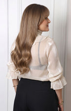 Blusa con olanes y mangas largas