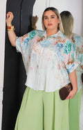 Blusa beige con estampado floral