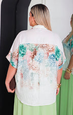 Blusa beige con estampado floral