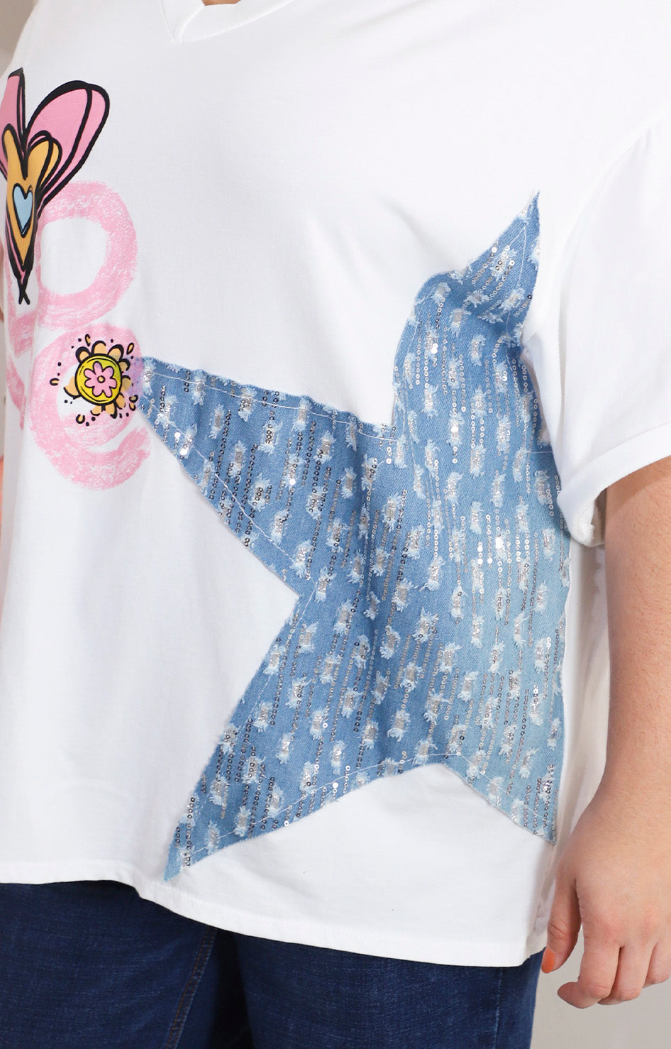 Blusa blanca con estrella denim