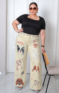 Pantalón beige con estampado de perritos