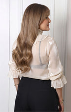 Blusa con olanes y mangas largas