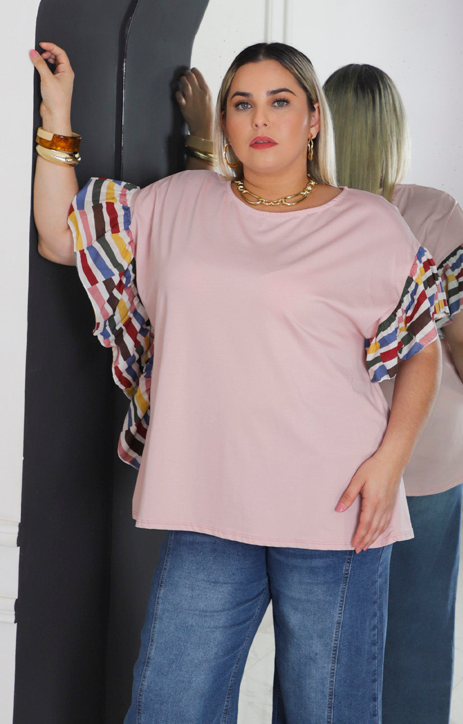 Blusa rosa con manga de olanes