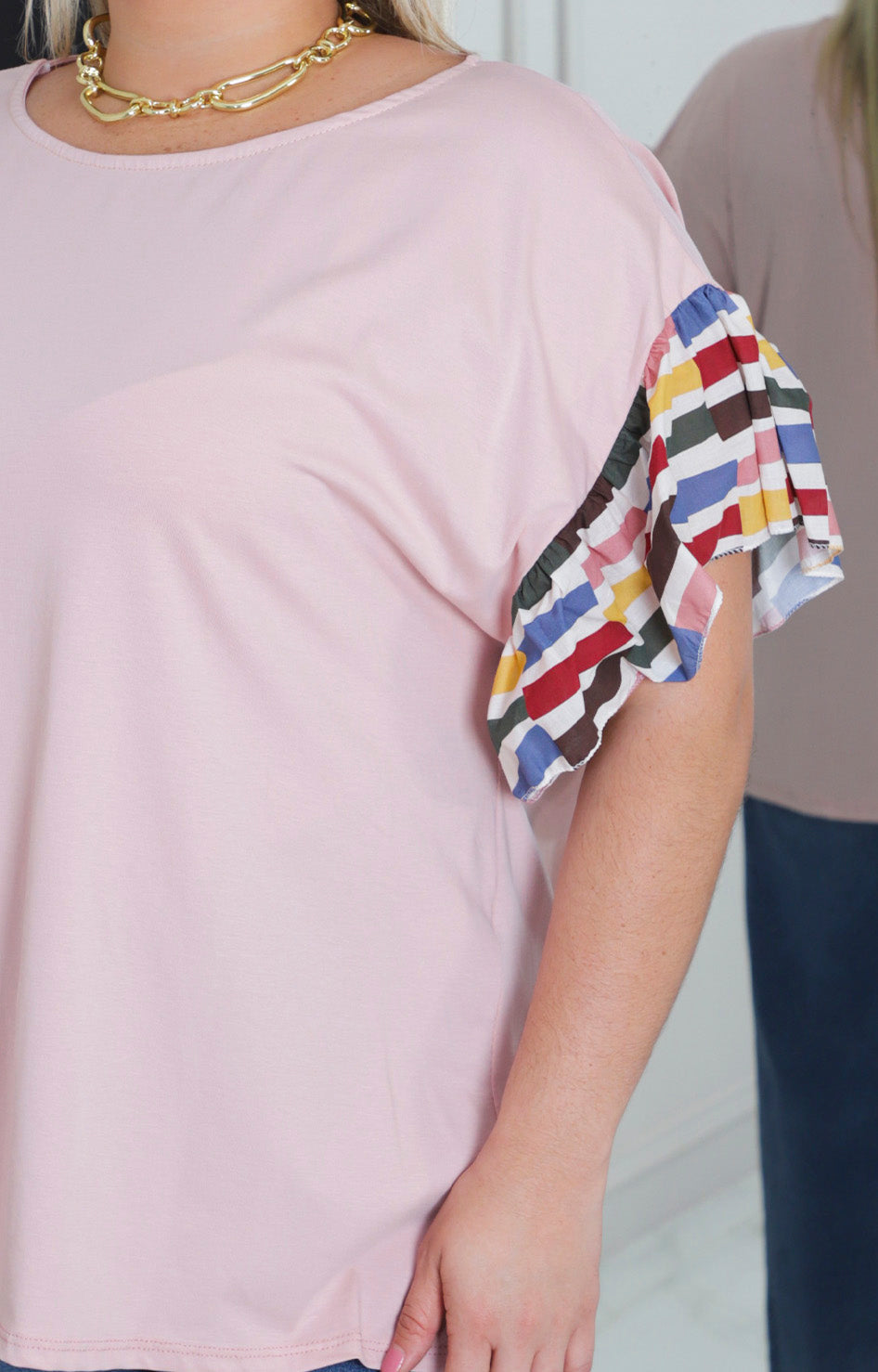 Blusa rosa con manga de olanes
