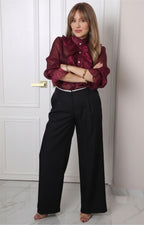 Blusa con olanes y mangas largas