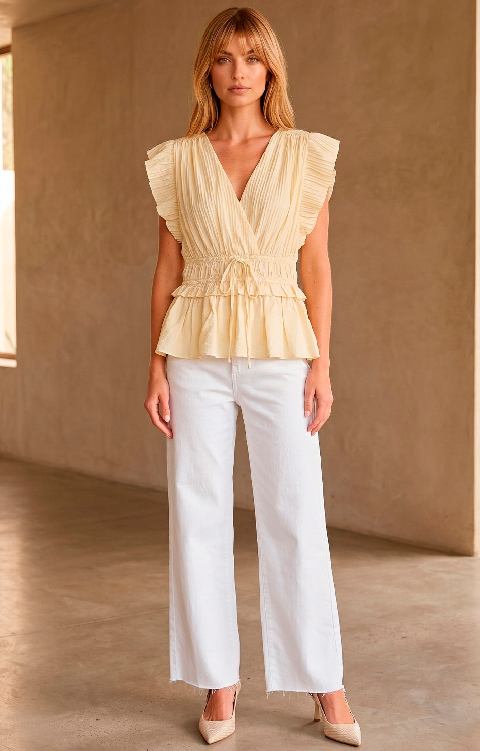 Blusa peplum plisada con volantes