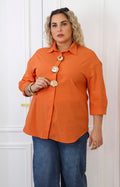 Blusa lisa con maxi botones