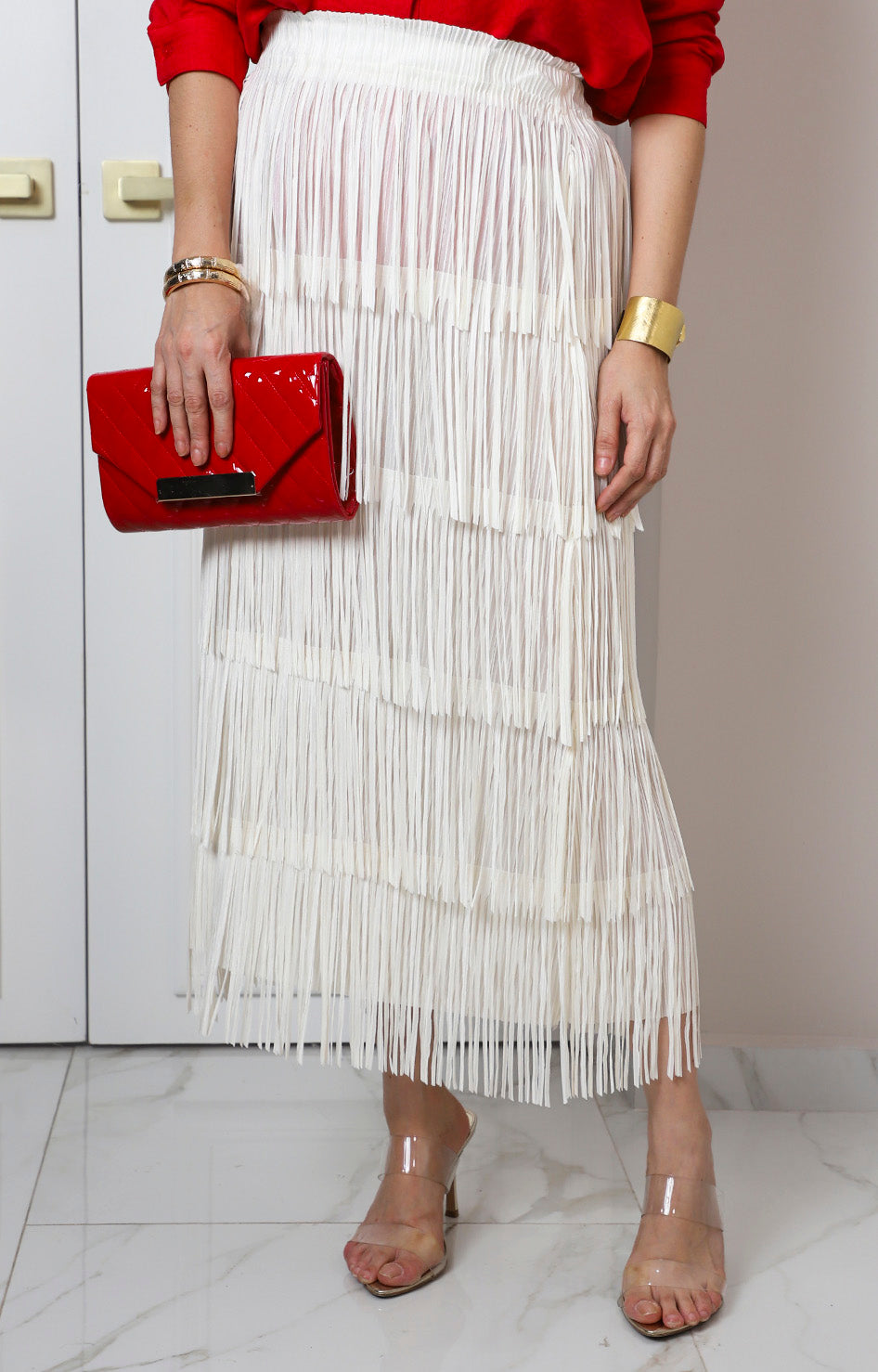 Falda beige de flecos en capas