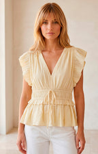 Blusa peplum plisada con volantes