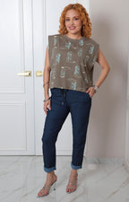 Blusa verde estampado de botas vaqueras