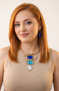 Set de collar y aretes geométricos con piedras azules