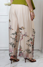 Pantalón beige con estampado floral