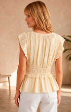 Blusa peplum plisada con volantes