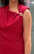 Blusa asimétrica con detalle dorado