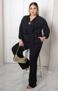 Palazzo negro largo curvy Boutiquemirel con broche dorado delantero