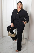 Palazzo negro largo curvy Boutiquemirel con broche dorado delantero
