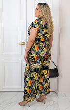 Palazzo negro con estampado tropical