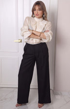 Blusa con olanes y mangas largas
