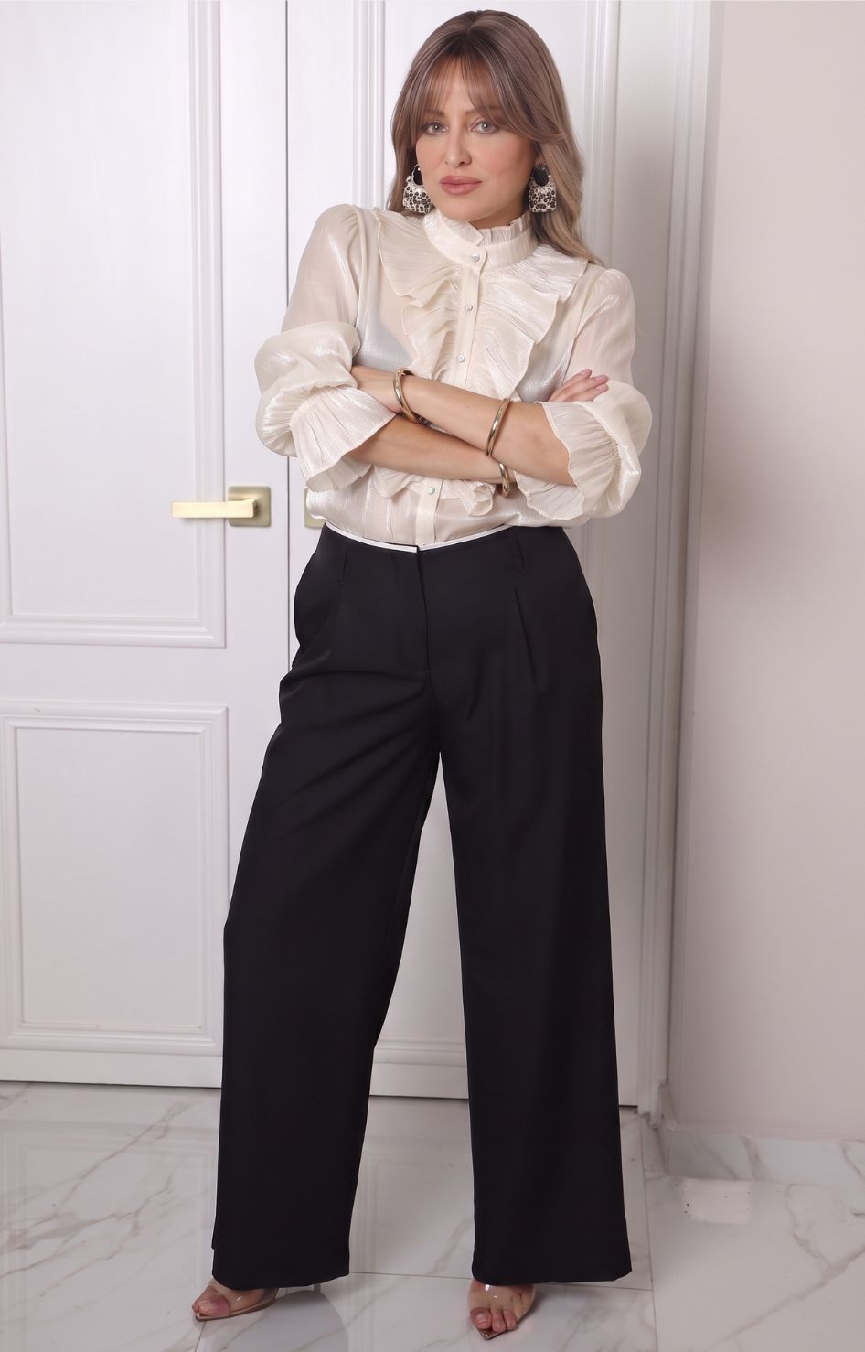 Blusa con olanes y mangas largas