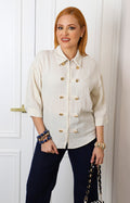 Blusa beige con botones dorados