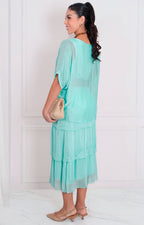 Vestido liso con volantes