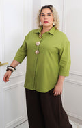 Blusa lisa con maxi botones