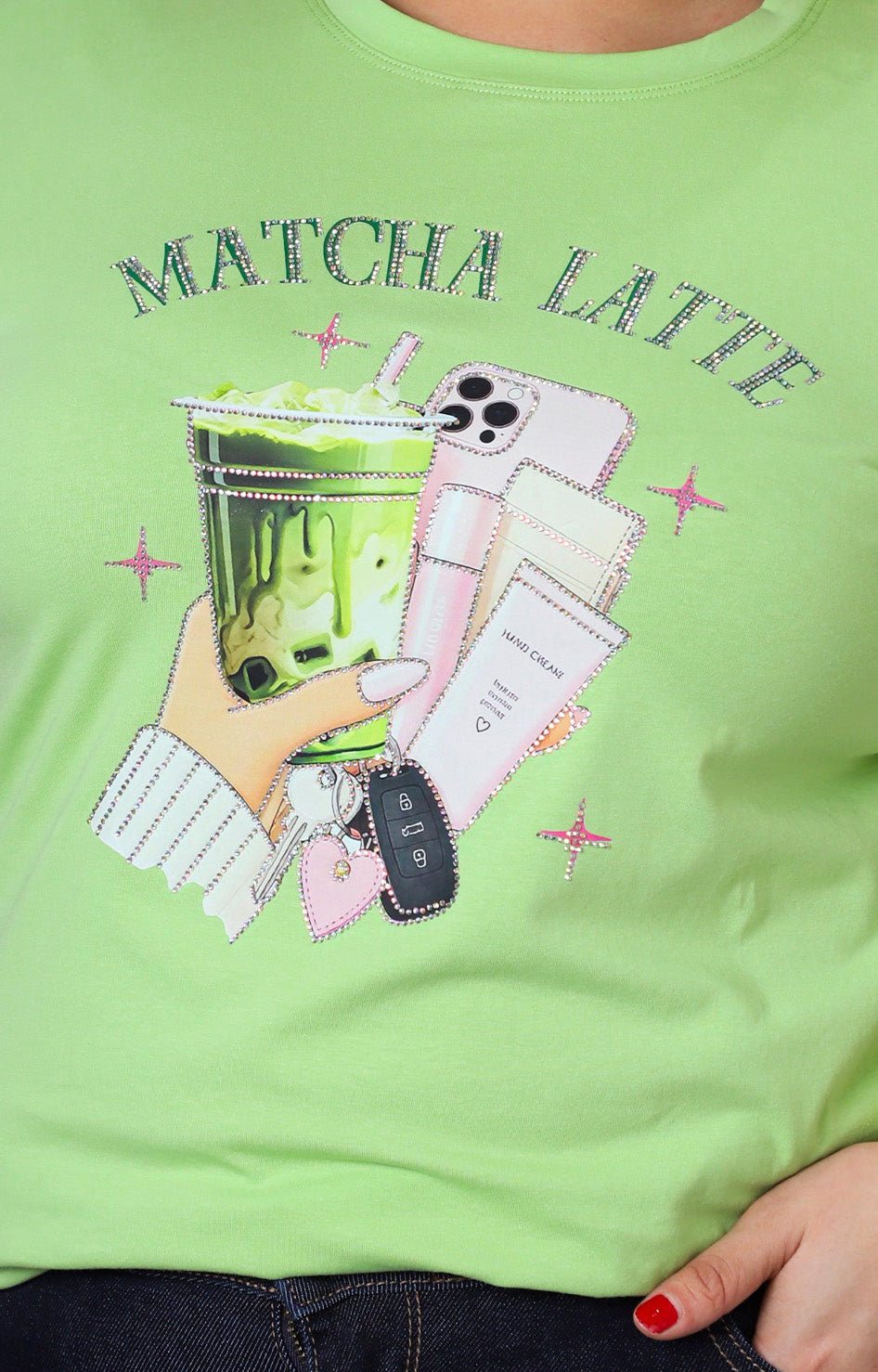 Blusa verde con estampado y aplicaciones