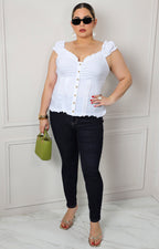 Blusa con olanes fruncidos y botones