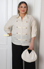 Blusa con botones dorados