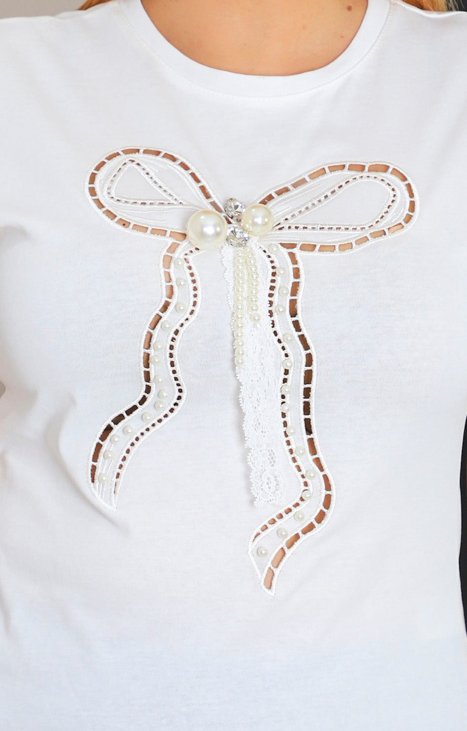 Blusa con aplique de moño