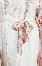 Vestido beige con estampado floral