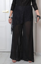 Pantalón negro de encaje con pierna ancha