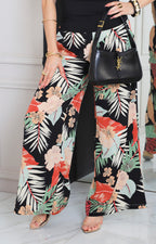 Pantalón negro con estampado tropical