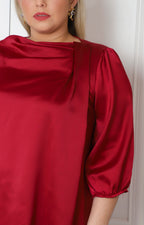 Blusa satinada con drapeado frontal y mangas globo