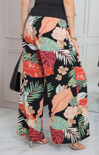 Pantalón negro con estampado tropical