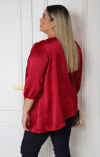 Blusa satinada con drapeado frontal y mangas globo
