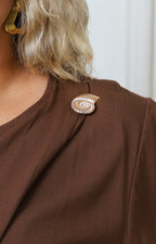 Blusa cruzada con detalle dorado