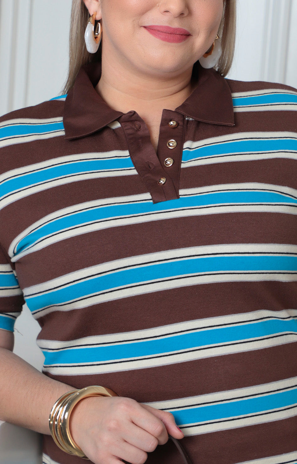 Blusa polo a rayas con cuello