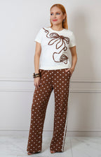 Conjunto Boutiquemirel de blusa blanca y pantalón de polka dots en diseño elegante