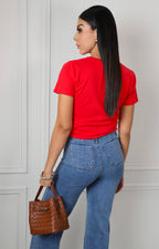 Blusa con estampado floral y aplicaciones
