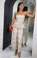 Conjunto beige strapless con bordado calado
