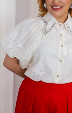 Blusa de manga globo bordada