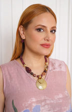 Set de collar y aretes con medallón texturizado