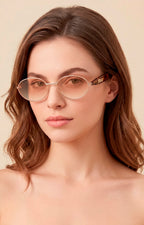 Lentes ovalados con detalle dorado
