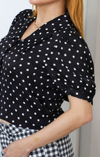 Blusa negra polka dots con manga globo