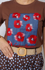 Blusa con estampado floral y aplicaciones
