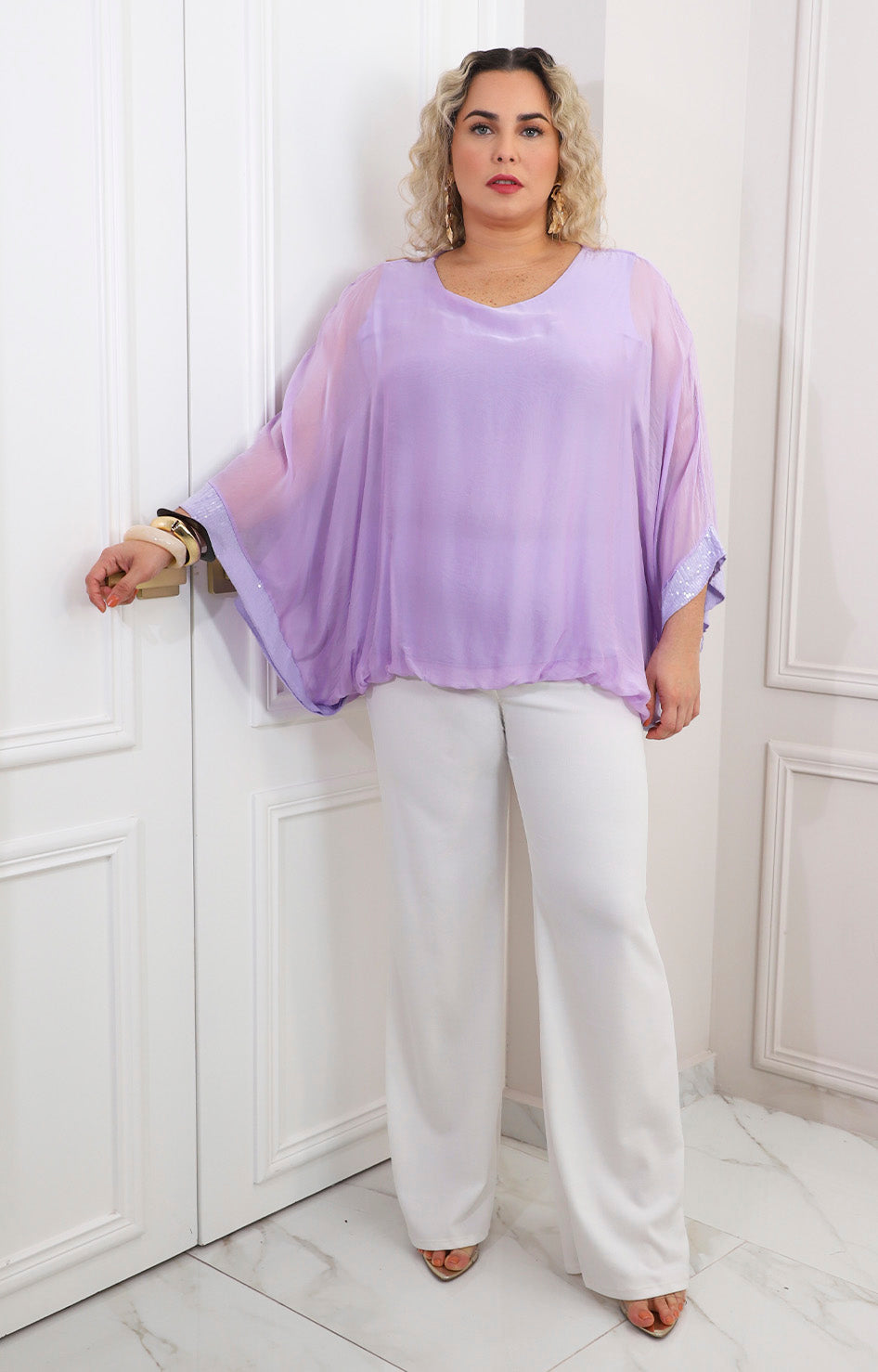Blusa de seda con brillos