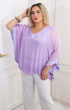Blusa de seda con brillos